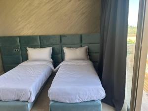 Tempat tidur dalam kamar di Villa luxueuse
