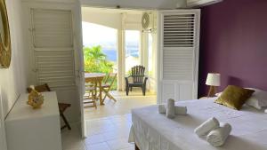 Легло или легла в стая в Indigo, Anse Mitan, beau F2 sublime vue mer, proche plage