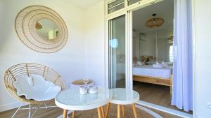 Una cama o camas en una habitación de Soley ka Chofé, Anse Mitan, Sublime T3 refait à neuf vue mer