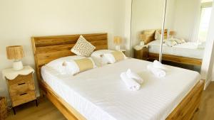 Una cama o camas en una habitación de Soley ka Chofé, Anse Mitan, Sublime T3 refait à neuf vue mer