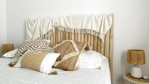 Una cama o camas en una habitación de Soley ka Chofé, Anse Mitan, Sublime T3 refait à neuf vue mer