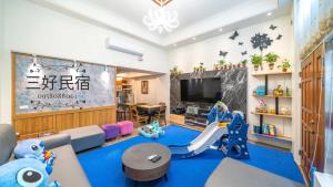 a living room with a play area with a slide at 羅東三好Sam-hao Homestay in Luodong