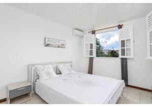 Voodi või voodid majutusasutuse Anthurium, Superbe haut de villa F3 proche plage, Anse Mitan toas