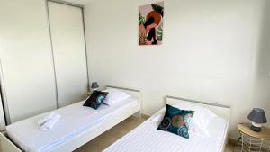 Letto o letti in una camera di Ti Bonheur
