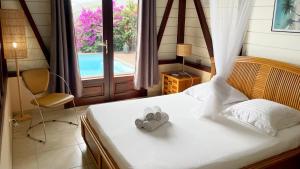 Voodi või voodid majutusasutuse Villa de charme avec piscine et magnifique vue mer toas