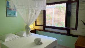 Voodi või voodid majutusasutuse Villa de charme avec piscine et magnifique vue mer toas