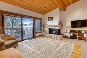 a living room with a fireplace and a tv at Our Lake House in Zephyr Cove