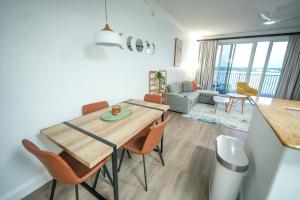 a dining room and living room with a table and chairs at Renovated Condo Blue Heron 5 pax in Orlando