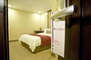 Postel nebo postele na pokoji v ubytování Goldberry Suites & Hotel Mactan