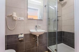 Kúpeľňa v ubytovaní Rabie Aparthotel