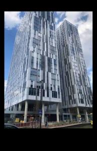 a large building with two tall buildings at Stylish Media city Manchester apartment in Manchester