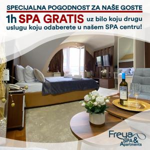 Pokój z łóżkiem i stołem z butelką wina w obiekcie Freya SPA Apartments w Niszu