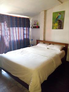 Cama o camas de una habitación en Hostal Inti raymi Backpackers