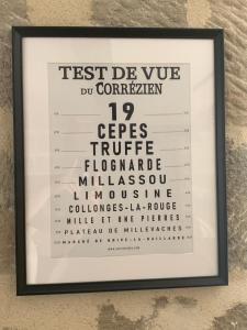 a framed picture of the test do you do differently sign at appartement de charme centre historique de Brive in Brive-la-Gaillarde