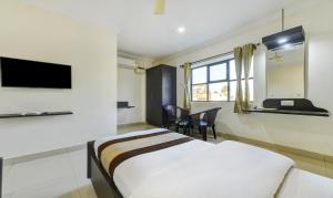 TV a/nebo společenská místnost v ubytování PLEASANT STAYS Hotel