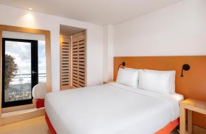 Voodi või voodid majutusasutuse Fairfield by Marriott Bogota Embajada toas