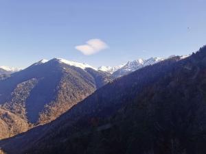 a view of a mountain range with snow covered mountains at Bagneres de luchon Hyper Centre in Luchon
