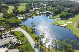 an aerial view of a golf course and a lake at 14th Hole Golf Course Views! in Wesley Chapel +42 photos