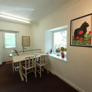 a dining room with a table and a window at Peaceful and Stunning Waterside Location in Helensburgh