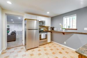 a kitchen with a stainless steel refrigerator at Aurora Vacation Rental 9 Mi to Downtown Denver in Aurora