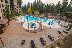 an overhead view of a swimming pool at a resort at #501-Pet Friendly, 1 Bedroom, Remodeled Village Monache Condo in Mammoth Lakes