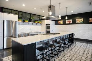 a kitchen with a large counter with stools at South Loop 1br w gym game room nr top schools CHI-988 in Chicago