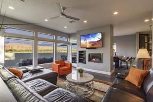 a living room with a couch and a fireplace at Exclusive Retreats Moab 3369 in Moab