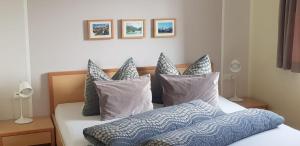 A bed or beds in a room at Panorama Erlebnis