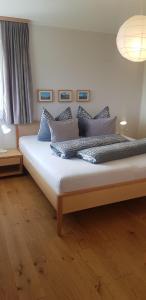 A bed or beds in a room at Panorama Erlebnis
