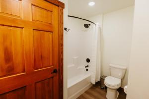 a bathroom with a toilet and a shower at Big Mountain Suite wIn-unit Washer and Dryer in Kalispell +7 photos