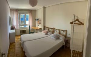 Ένα ή περισσότερα κρεβάτια σε δωμάτιο στο La Siete de San Lorenzo