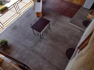 an overhead view of a table and chairs in a room at Appartamento Teoperga in Sotto il Monte +16 photos