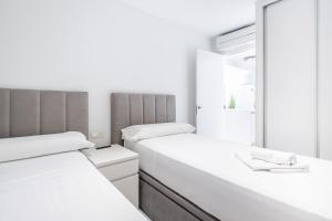 Postel nebo postele na pokoji v ubytování Veracruz 5-C Deluxe Apartment Levante Beach