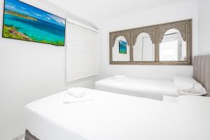 Postel nebo postele na pokoji v ubytování Veracruz 5-C Deluxe Apartment Levante Beach + 27 fotografií