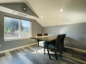 a dining room with a table and chairs and a window at Green Lake 1st Line Home B with Central Air Conditioners in Seattle