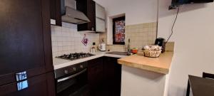 a kitchen with a stove and a counter top at Casa la Gardenia in SantʼOreste