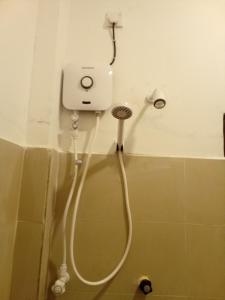 a bathroom with a blow dryer in the wall at Kusuma's Lazy Left in Midigama East