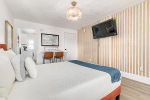 מיטה או מיטות בחדר ב-Satoshi Hideout Sol Apartments