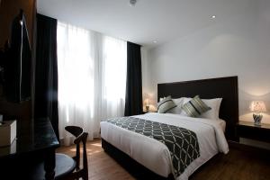 Voodi või voodid majutusasutuse Belllo Hotel JB Central toas