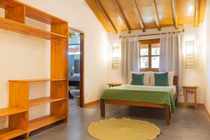 Кровать или кровати в номере Casa Agripina- Pariri Quadrado