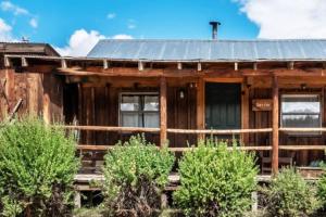 a wooden house with a metal roof at New! Charming cozy Cabin Colorado National Forest in Lake George +14 photos