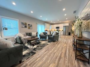 a living room with a couch and a table at Brand New Build Cozy Private 3br2ba Home in South Euclid