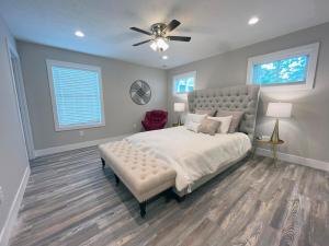 a bedroom with a bed and a ceiling fan at Brand New Build Cozy Private 3br2ba Home in South Euclid