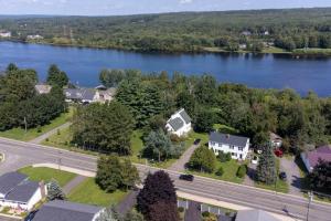 an aerial view of a house next to a river at Family Place that Feels like Home in Fredericton