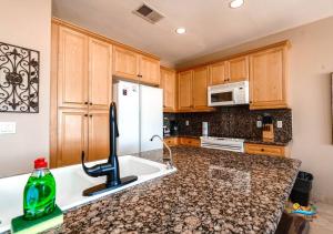a kitchen with a sink and a white refrigerator at Come, Experience, Collect memories 24-1 in San Felipe +26 photos