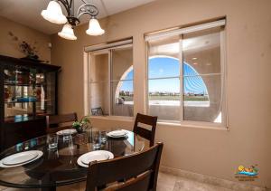 a dining room with a table and a window at Come, Experience, Collect memories 24-1 in San Felipe