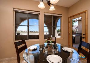 a dining room with a glass table and chairs at Come, Experience, Collect memories 24-1 in San Felipe