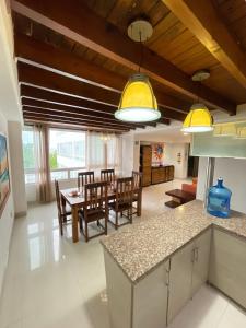 a kitchen and dining room with a table and chairs at Edificio Bahia Fragata Apartamento 411 in San Andrés