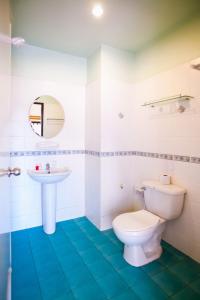 a bathroom with a toilet and a sink at Klong Muang Sunset House in Klong Muang Beach