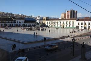 a city square with a car parked in the middle at Hotel San Francisco in Tunja